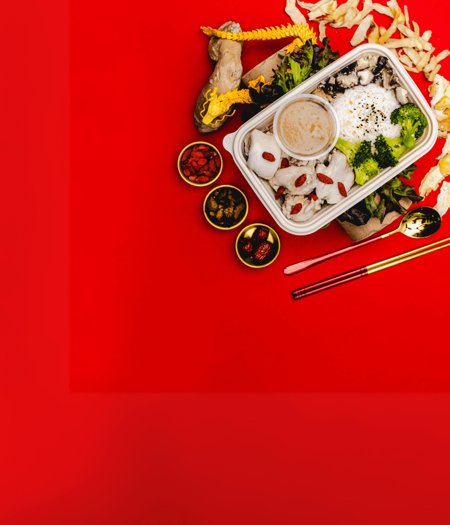 A Plate Of Food With Chopsticks And Sauce On A Red Background.
